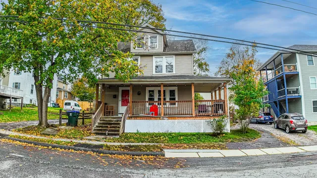 a view of a house with a yard and plants