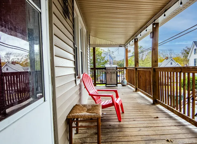 a view of a balcony with chairs