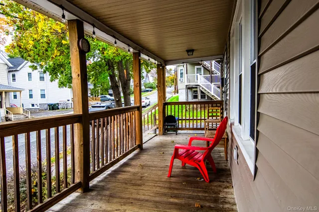 a view of a porch with wooden floor