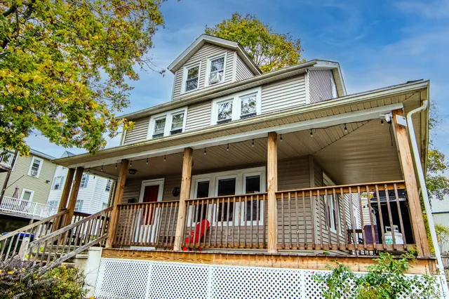 front view of a house with a small yard