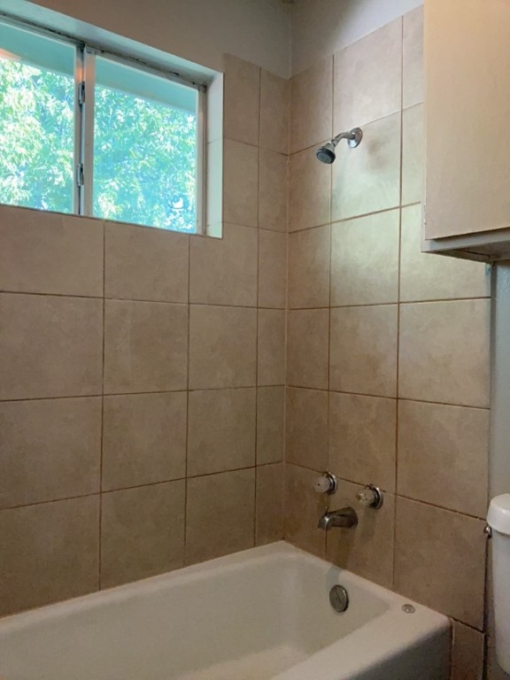 512 Lenora Drive, Unit B Taylor, TX 76574 - Photo 9 of 11 a bath tub sitting next to a window