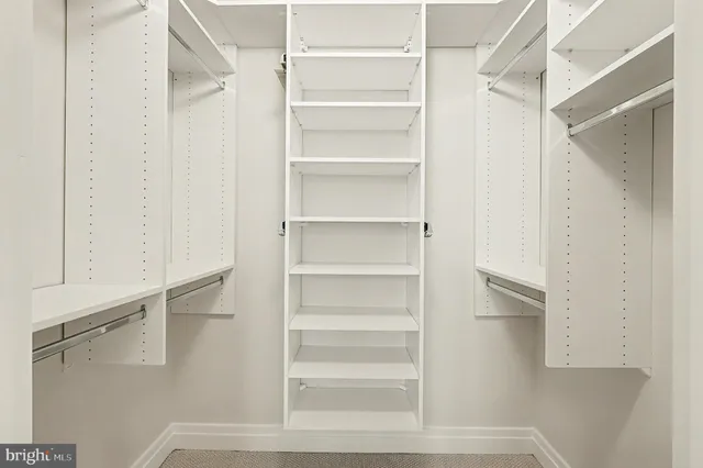 a bathroom with a granite countertop sink mirror and double