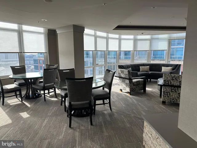 a kitchen with granite countertop a table and chairs in it