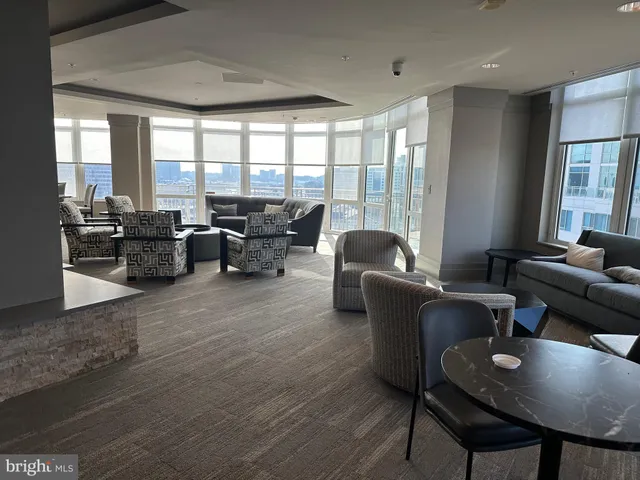 a view of a dining room with furniture and window