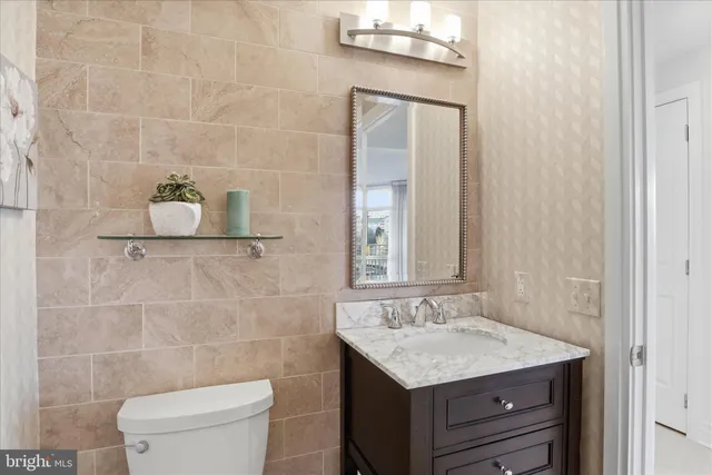 a large white kitchen with a table and chairs