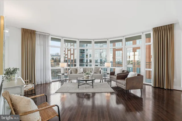 a kitchen with kitchen island a counter top space cabinets and stainless steel appliances