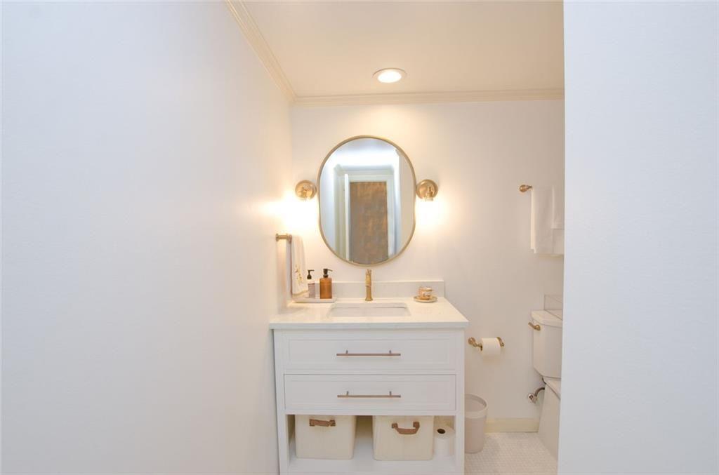 2734 Peachtree Road Northwest, Unit C101 Atlanta, GA 30305 - Photo 14 of 23 a bathroom with a sink and a mirror
