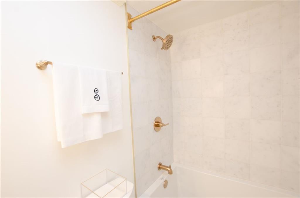 2734 Peachtree Road Northwest, Unit C101 Atlanta, GA 30305 - Photo 15 of 23 a bathroom with a shower