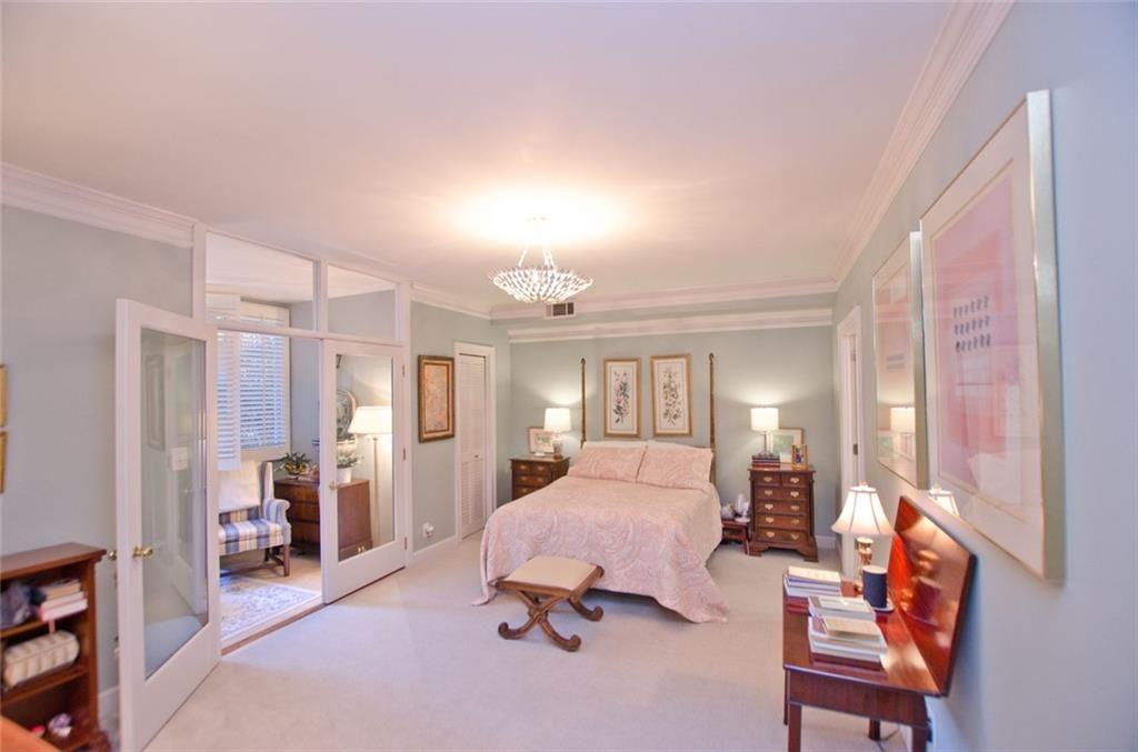 2734 Peachtree Road Northwest, Unit C101 Atlanta, GA 30305 - Photo 16 of 23 a bedroom with furniture and a window