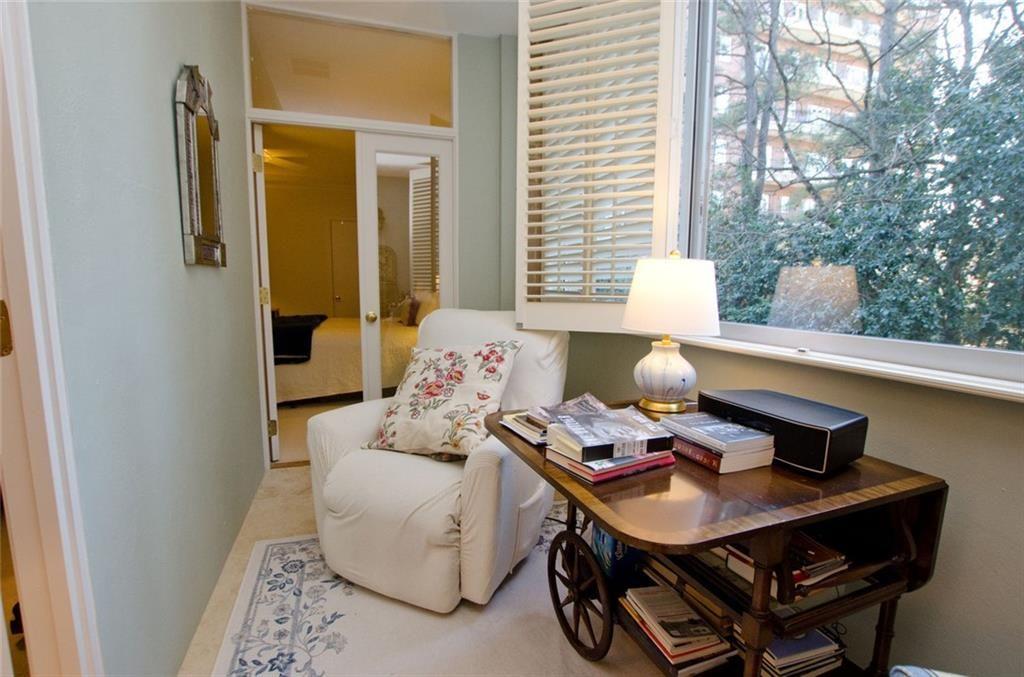 2734 Peachtree Road Northwest, Unit C101 Atlanta, GA 30305 - Photo 18 of 23 a living room with furniture and a window