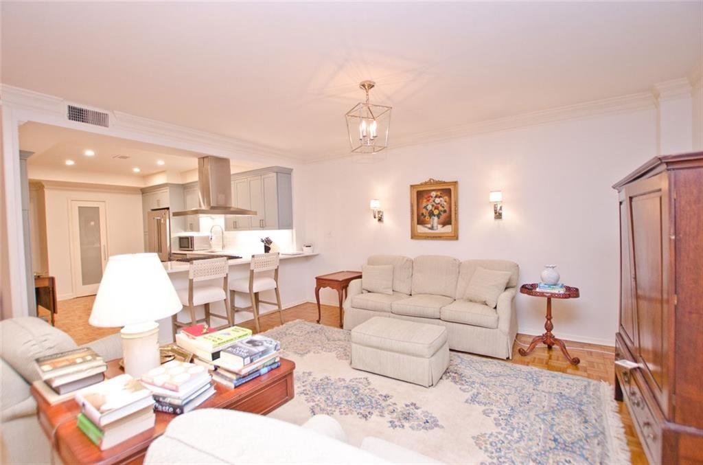 2734 Peachtree Road Northwest, Unit C101 Atlanta, GA 30305 - Photo 8 of 23 a living room with furniture and kitchen view