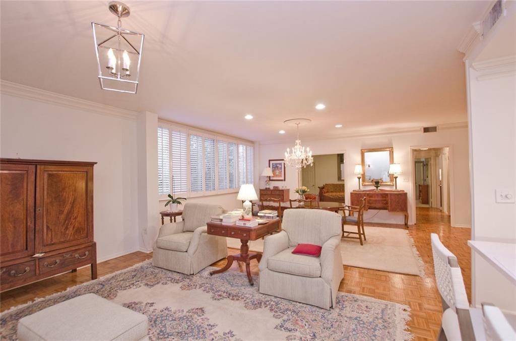 2734 Peachtree Road Northwest, Unit C101 Atlanta, GA 30305 - Photo 9 of 23 a living room with furniture and a window