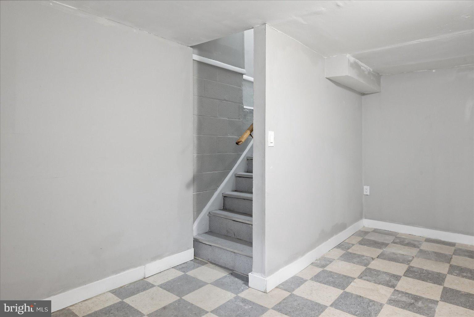 9110 Meadow Heights Road Randallstown, MD 21133 - Photo 25 of 39 Spacious entryway with staircase charm.
