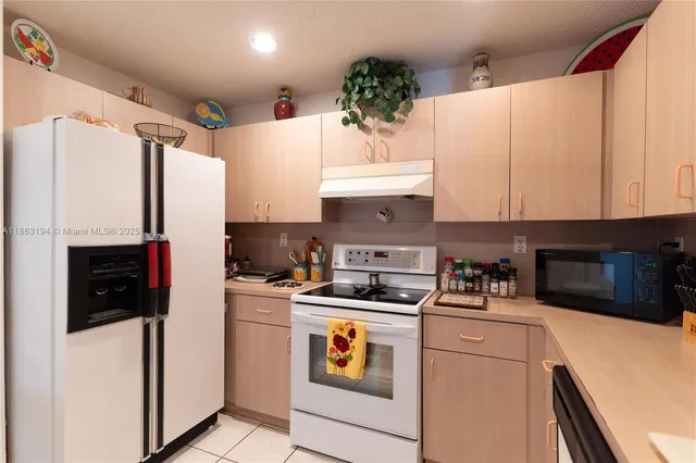 a room with furniture a chandelier and a window