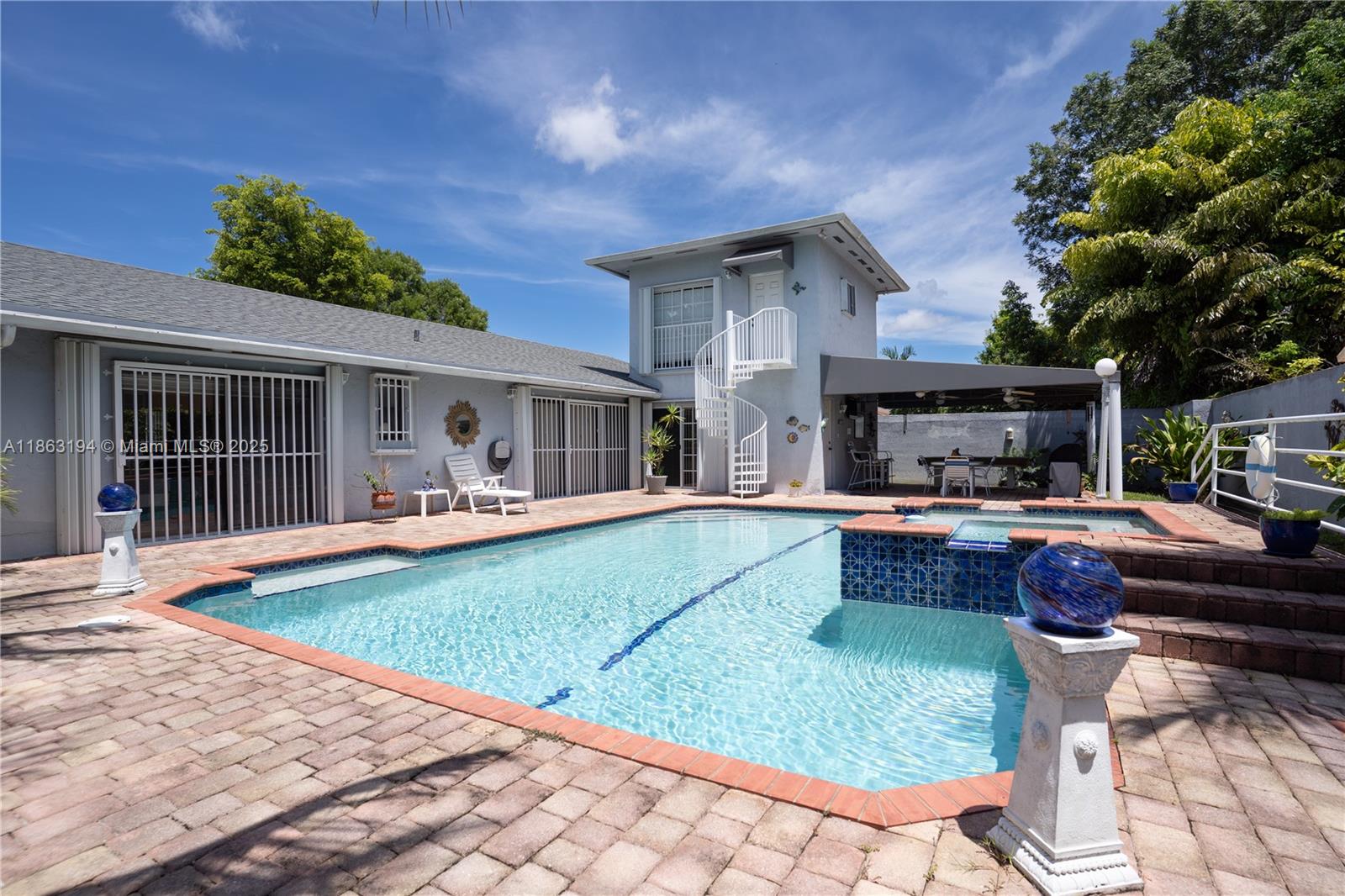 11680 Southwest 92nd Street Miami, FL 33176 - Photo 26 of 44 a view of house with swimming pool outdoor seating