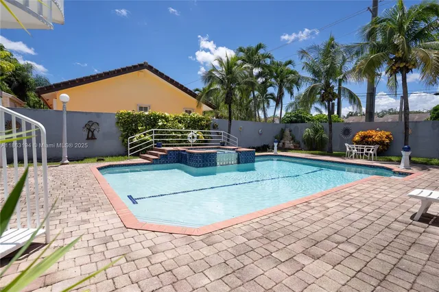 a outdoor dining space with furniture and outdoor kitchen