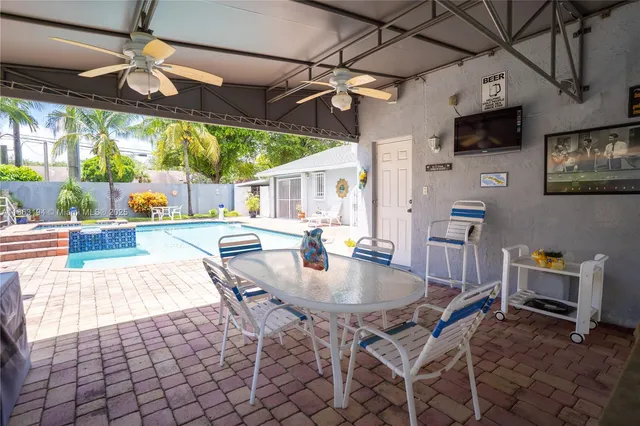 a living room with furniture a rug and a window