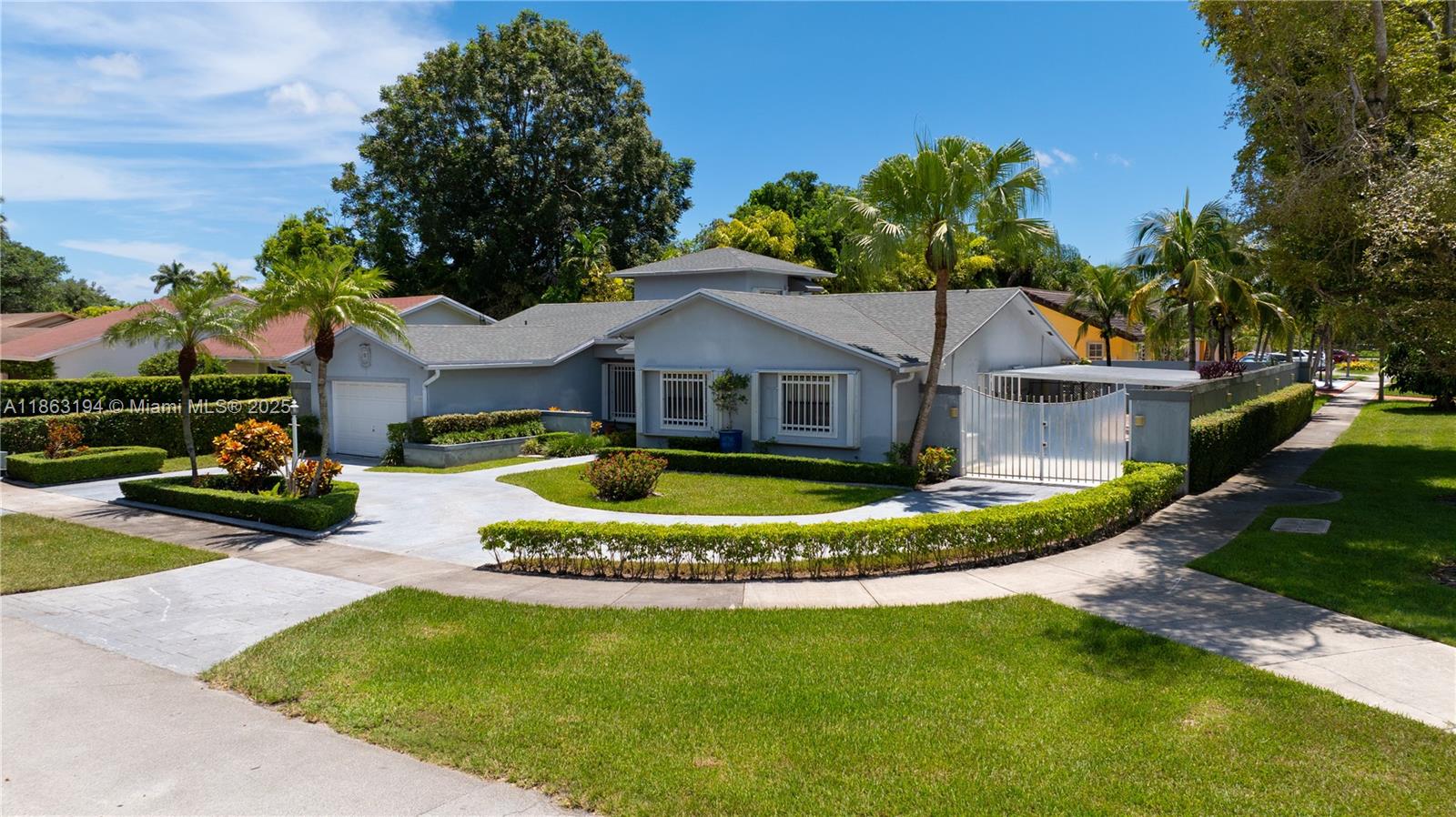 11680 Southwest 92nd Street Miami, FL 33176 - Photo 3 of 44 a front view of a house with a garden