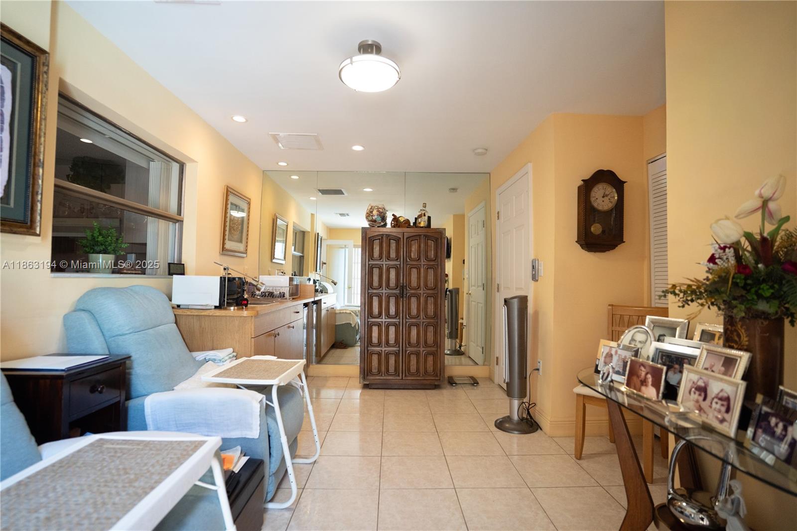 11680 Southwest 92nd Street Miami, FL 33176 - Photo 31 of 44 a living room with furniture a window and a chandelier