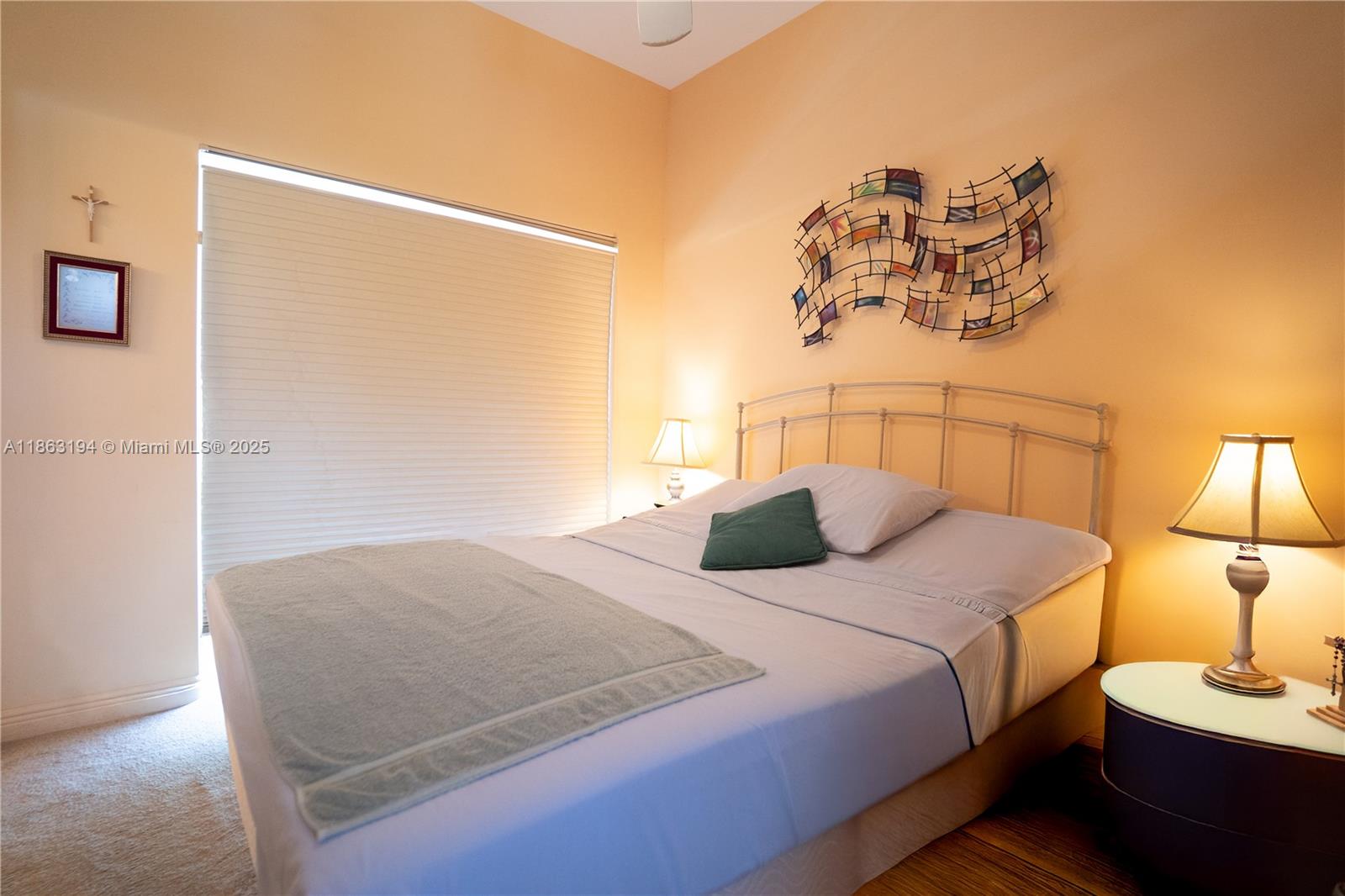 11680 Southwest 92nd Street Miami, FL 33176 - Photo 36 of 44 a bedroom with a bed and a painting on the wall