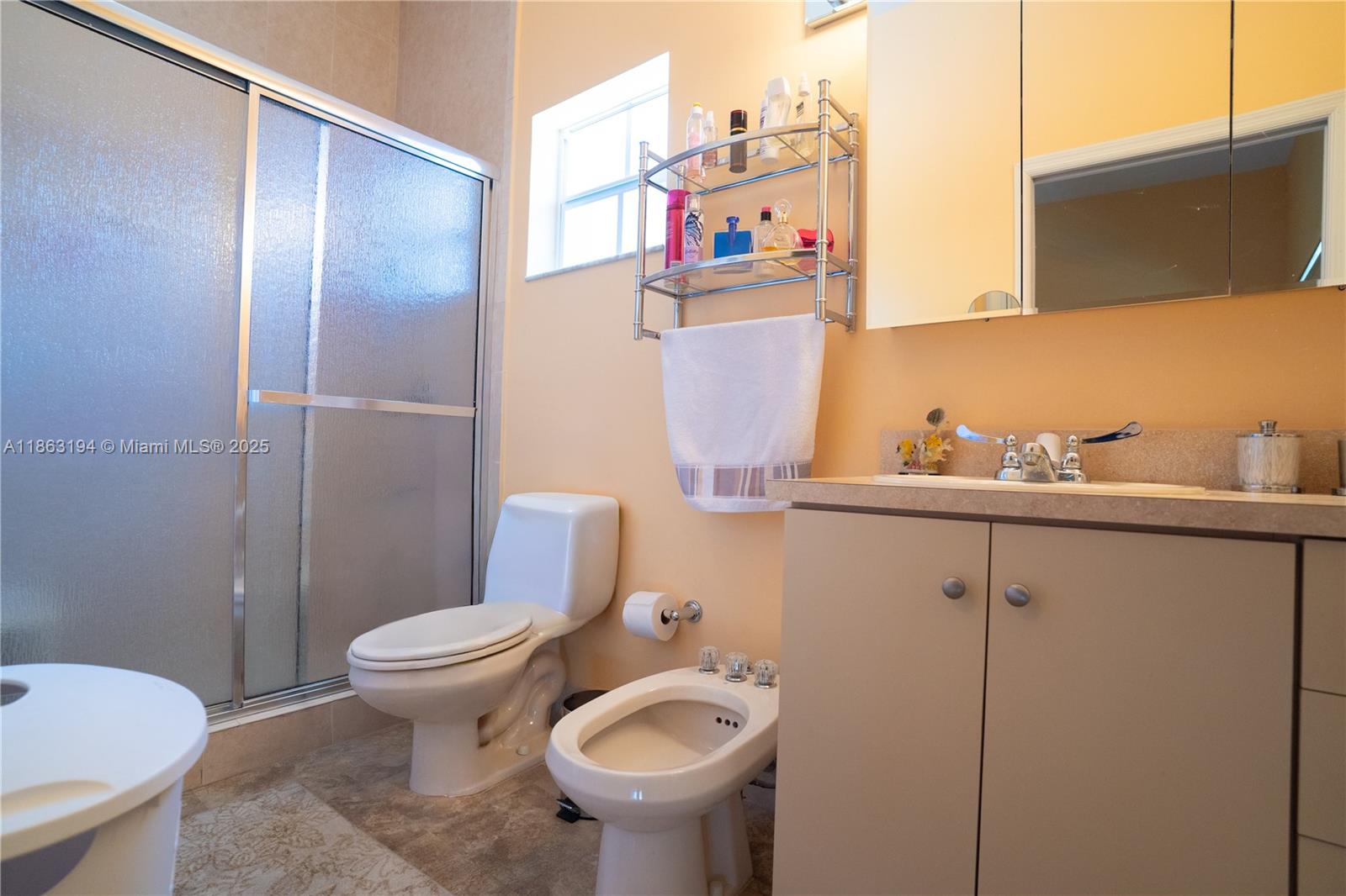 11680 Southwest 92nd Street Miami, FL 33176 - Photo 38 of 44 a bathroom with a toilet sink and mirror