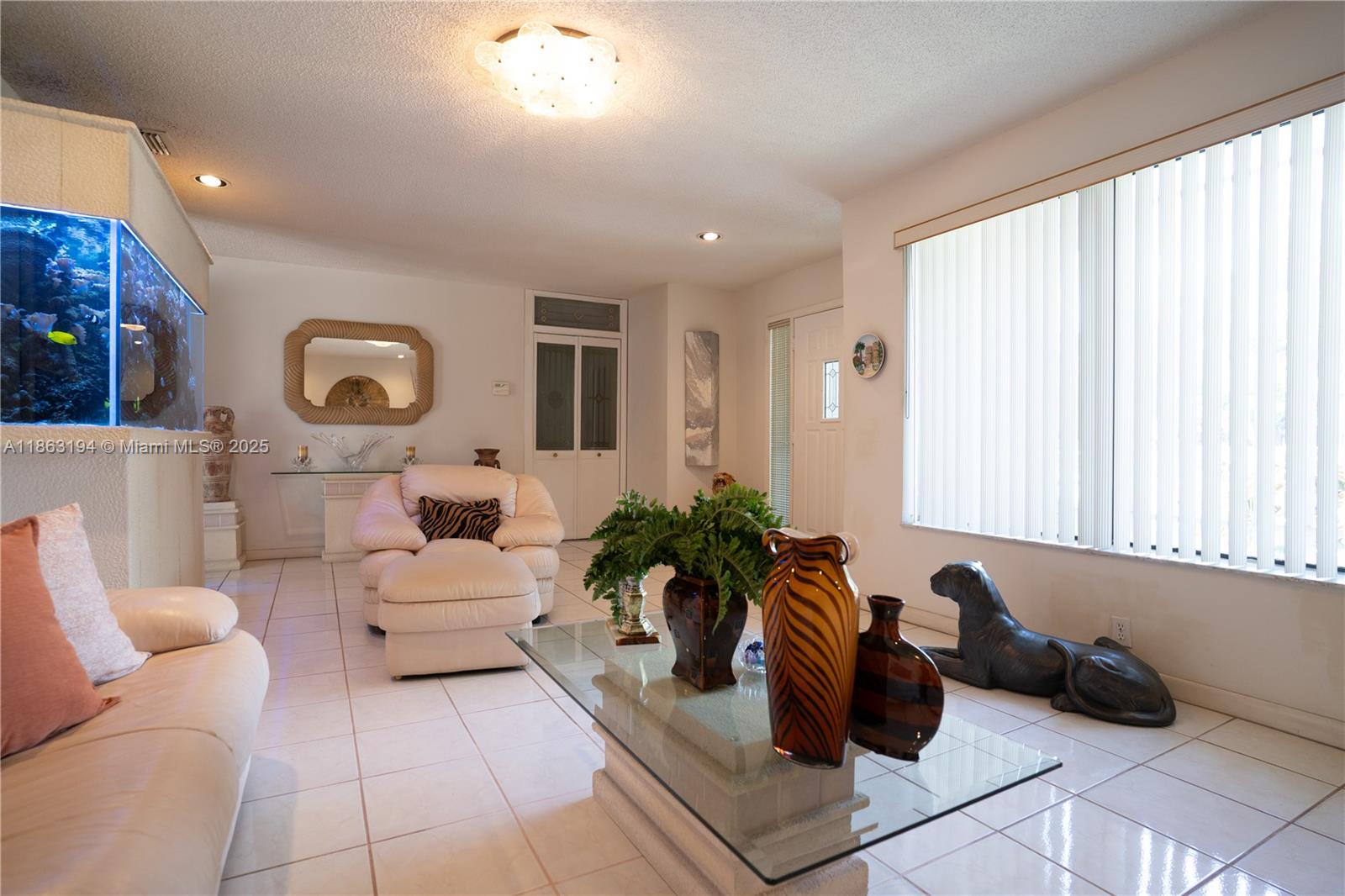 11680 Southwest 92nd Street Miami, FL 33176 - Photo 6 of 44 a living room with furniture and a large window