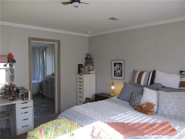 a bedroom with a bed and furniture