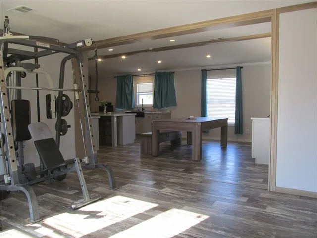 a lobby with furniture and wooden floor