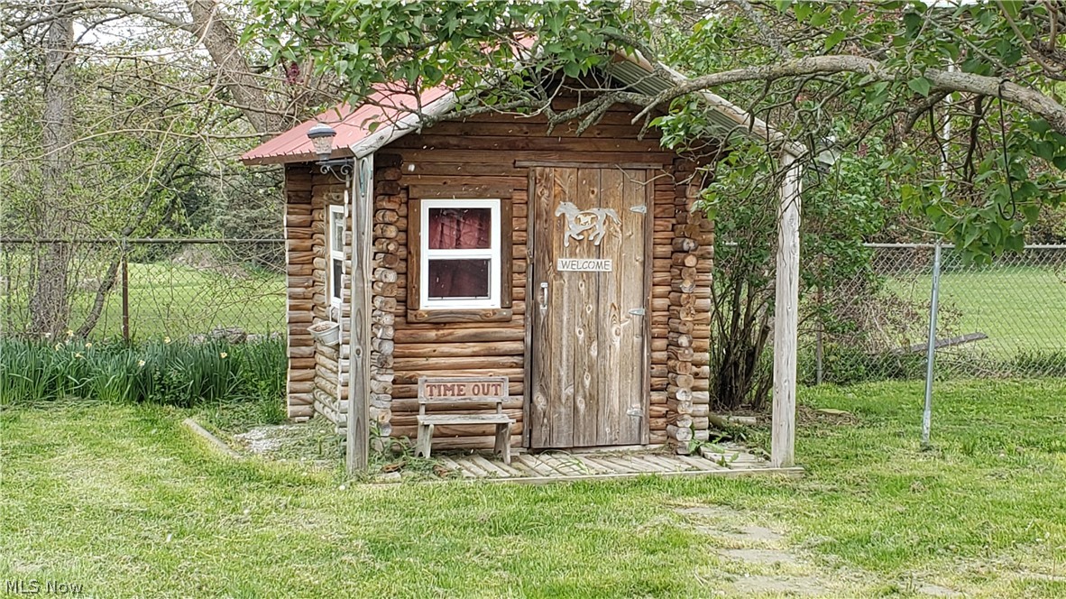 14990 Baird Road Oberlin, OH 44074 - Photo 24 of 25 Kids Playhouse, or storage for garden equipment.