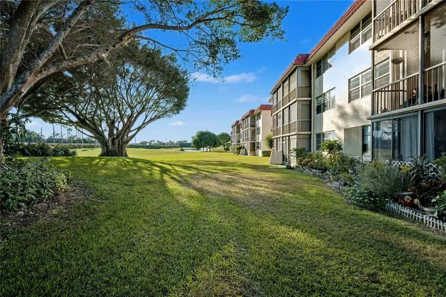 a view of a building with a yard