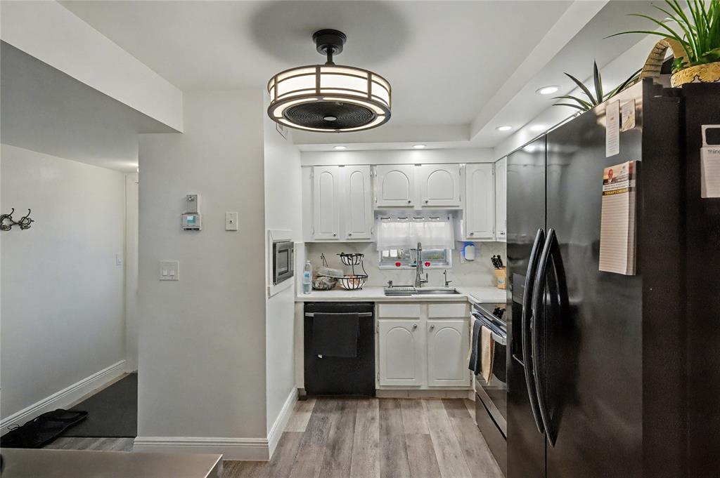 9520 South Hollybrook Lake Drive, Unit 103 Pembroke Pines, FL 33025 - Photo 2 of 55 a kitchen with stainless steel appliances a refrigerator and a stove top oven