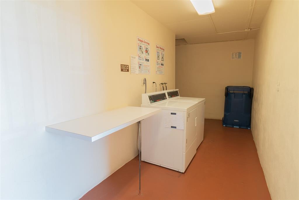 9520 South Hollybrook Lake Drive, Unit 103 Pembroke Pines, FL 33025 - Photo 22 of 55 a utility room with cabinets washer and dryer