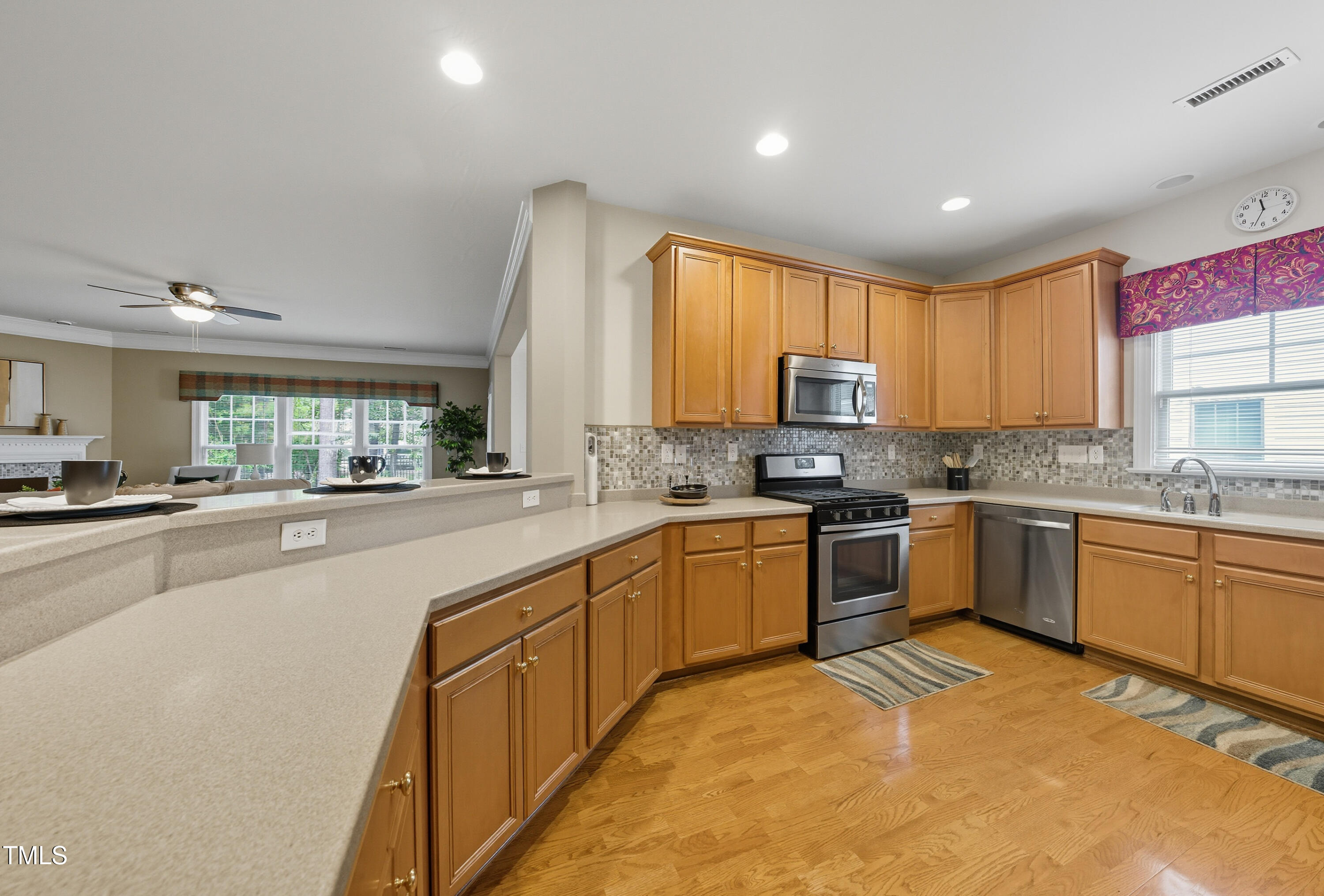 5210 Rio Grande Drive Raleigh, NC 27616 - Photo 11 of 45 a open kitchen with granite countertop a stove top oven a sink a counter space and cabinets