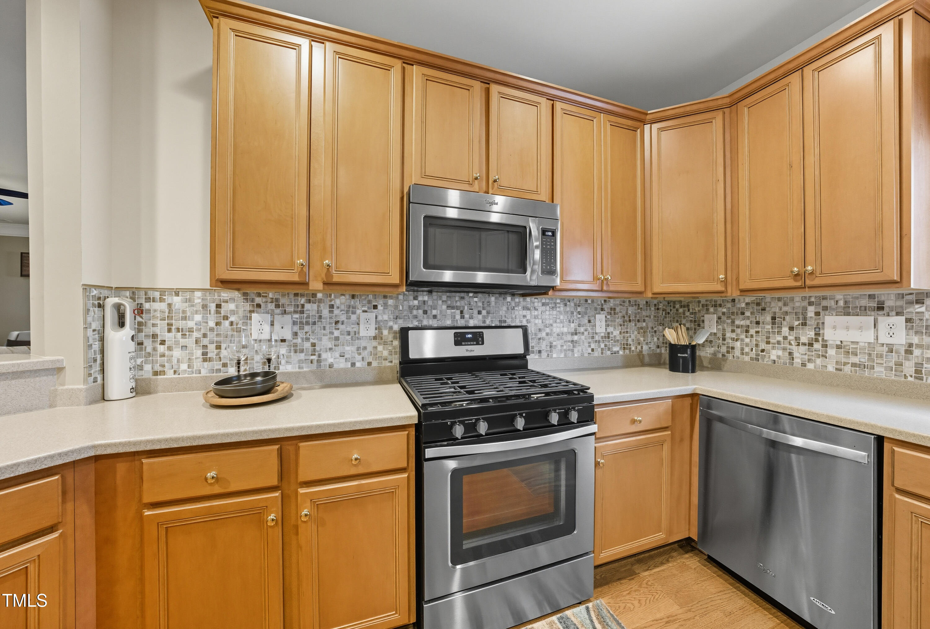 5210 Rio Grande Drive Raleigh, NC 27616 - Photo 12 of 45 a kitchen with stainless steel appliances granite countertop white cabinets sink and a granite counter top