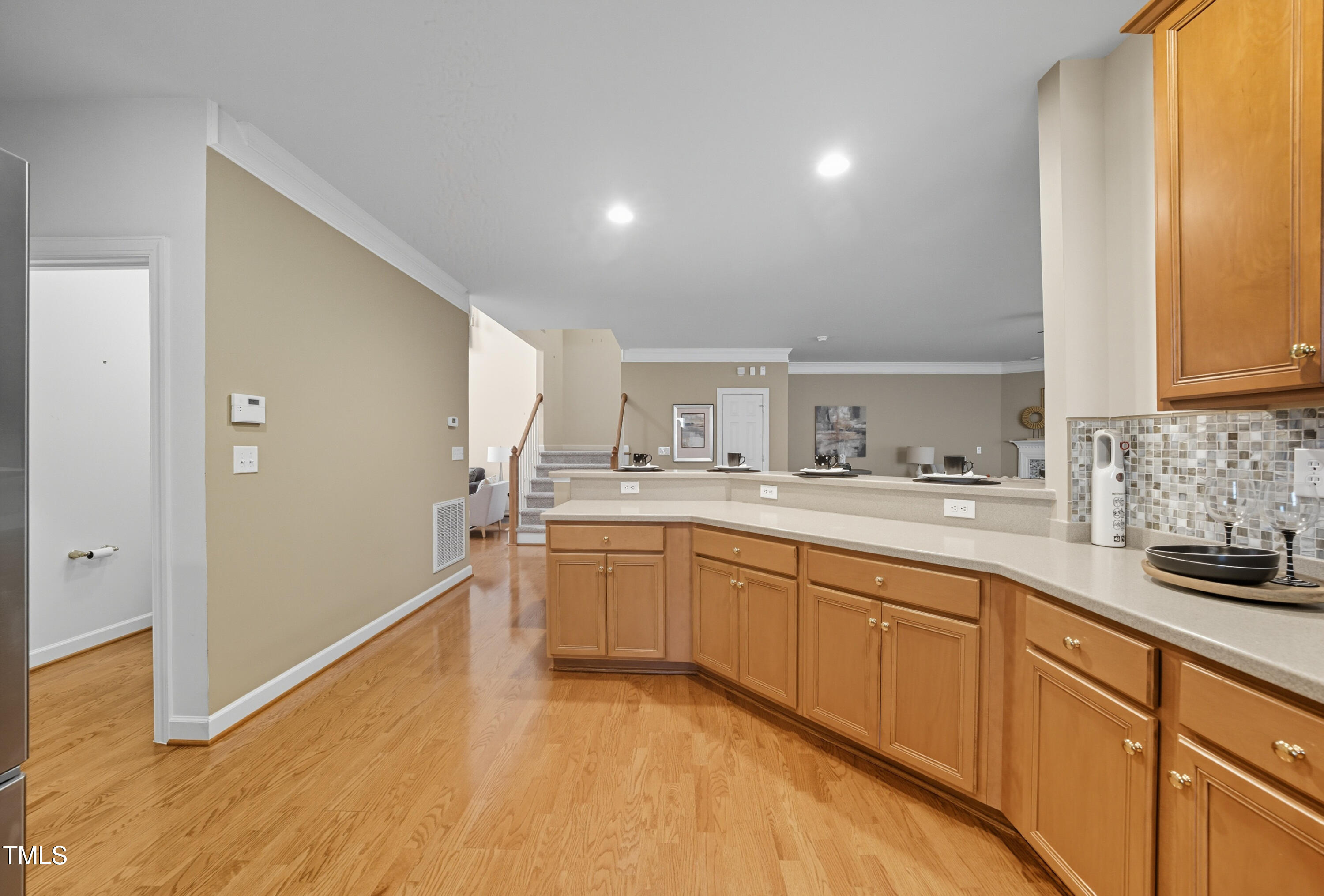 5210 Rio Grande Drive Raleigh, NC 27616 - Photo 15 of 45 a large kitchen with cabinets and wooden floor