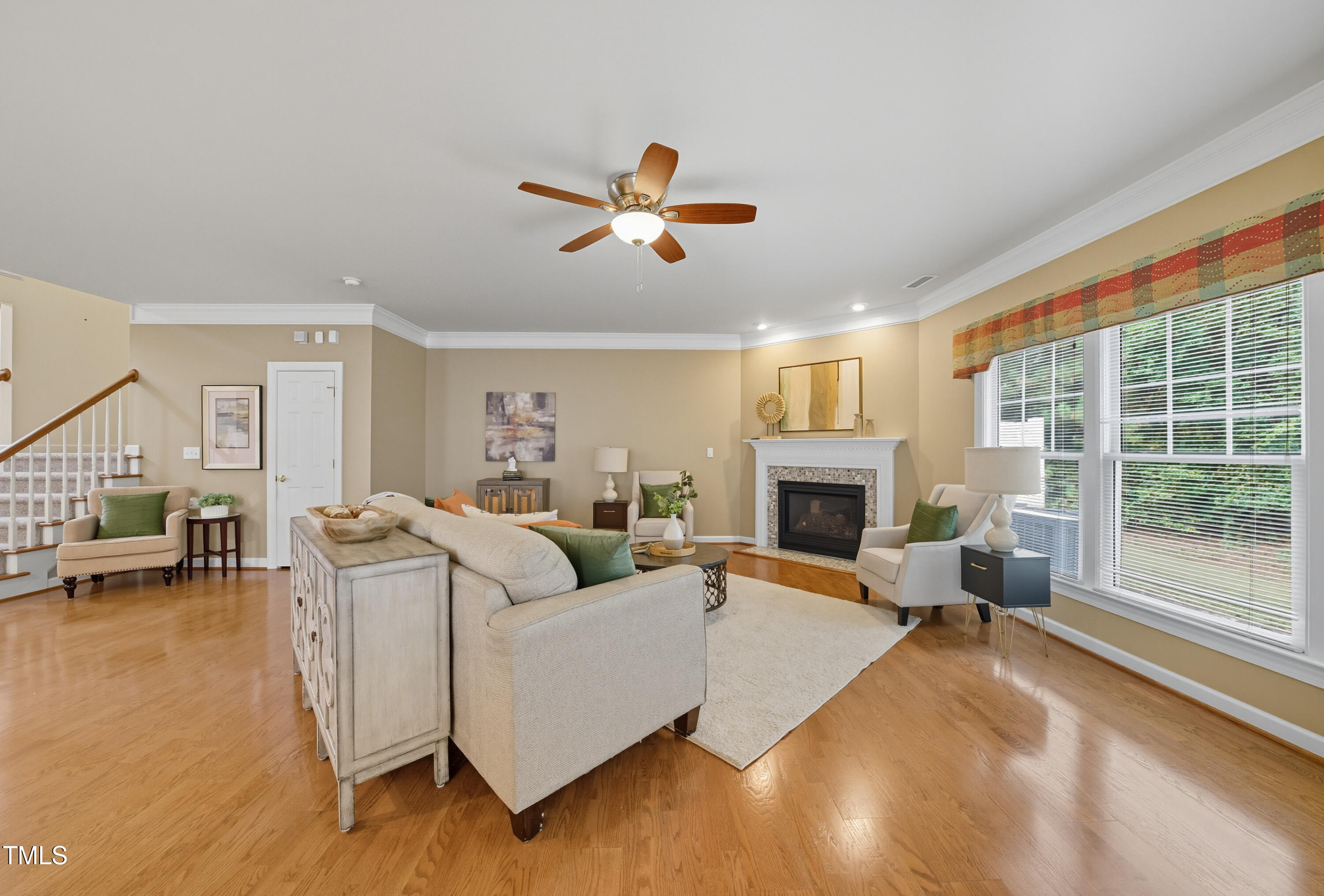 5210 Rio Grande Drive Raleigh, NC 27616 - Photo 19 of 45 a living room with furniture large window and a fireplace