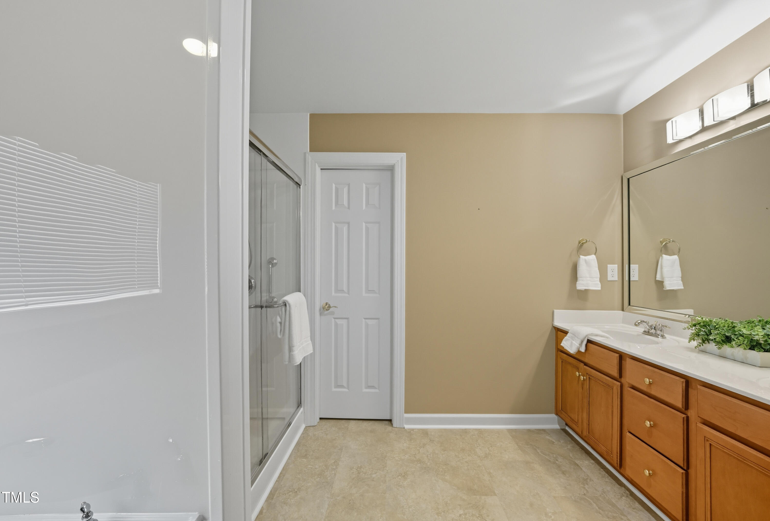 5210 Rio Grande Drive Raleigh, NC 27616 - Photo 31 of 45 a spacious bathroom with a double vanity sink and a mirror