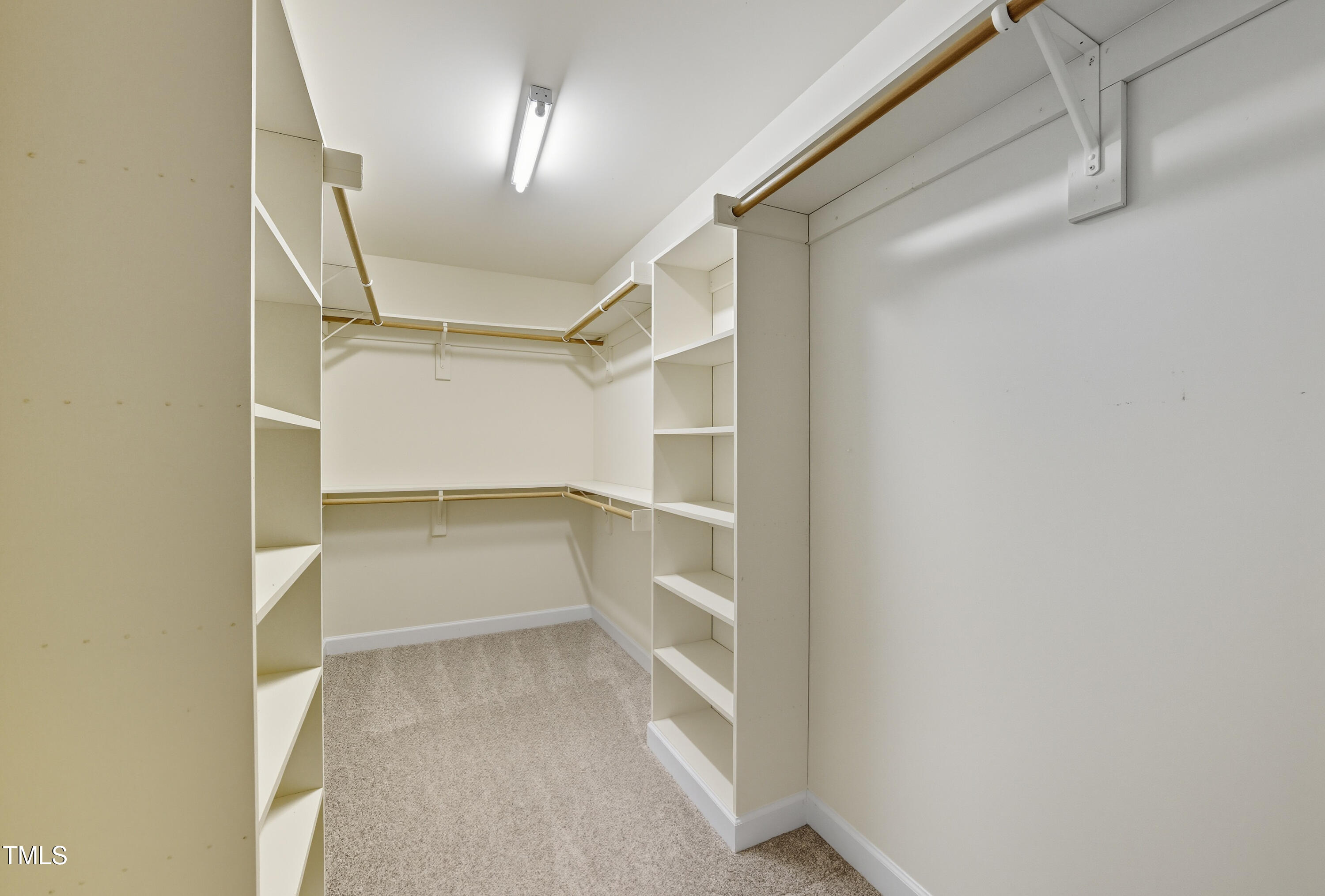 5210 Rio Grande Drive Raleigh, NC 27616 - Photo 35 of 45 a view of walk in closet with empty racks