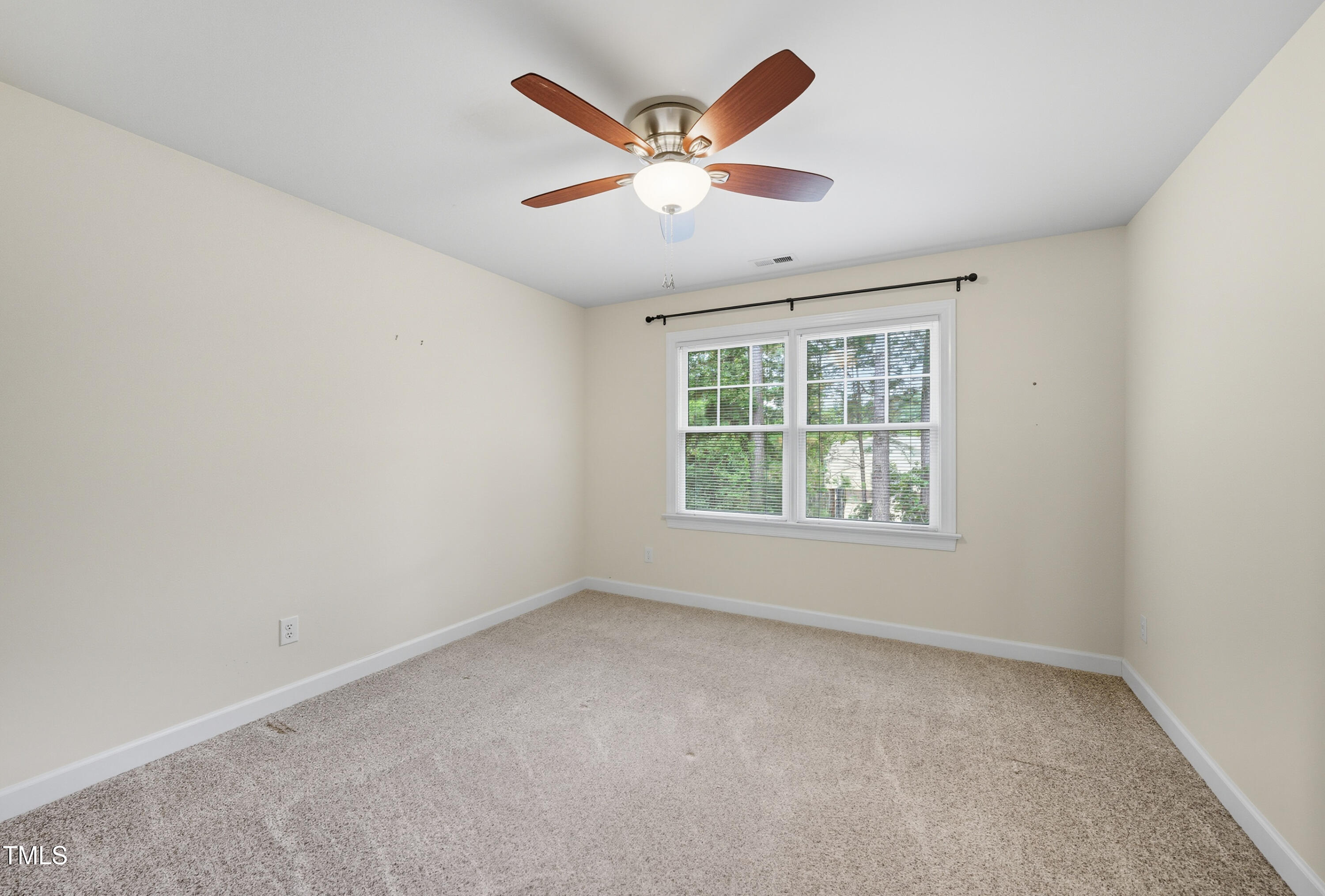 5210 Rio Grande Drive Raleigh, NC 27616 - Photo 36 of 45 an empty room with ceiling fan and window