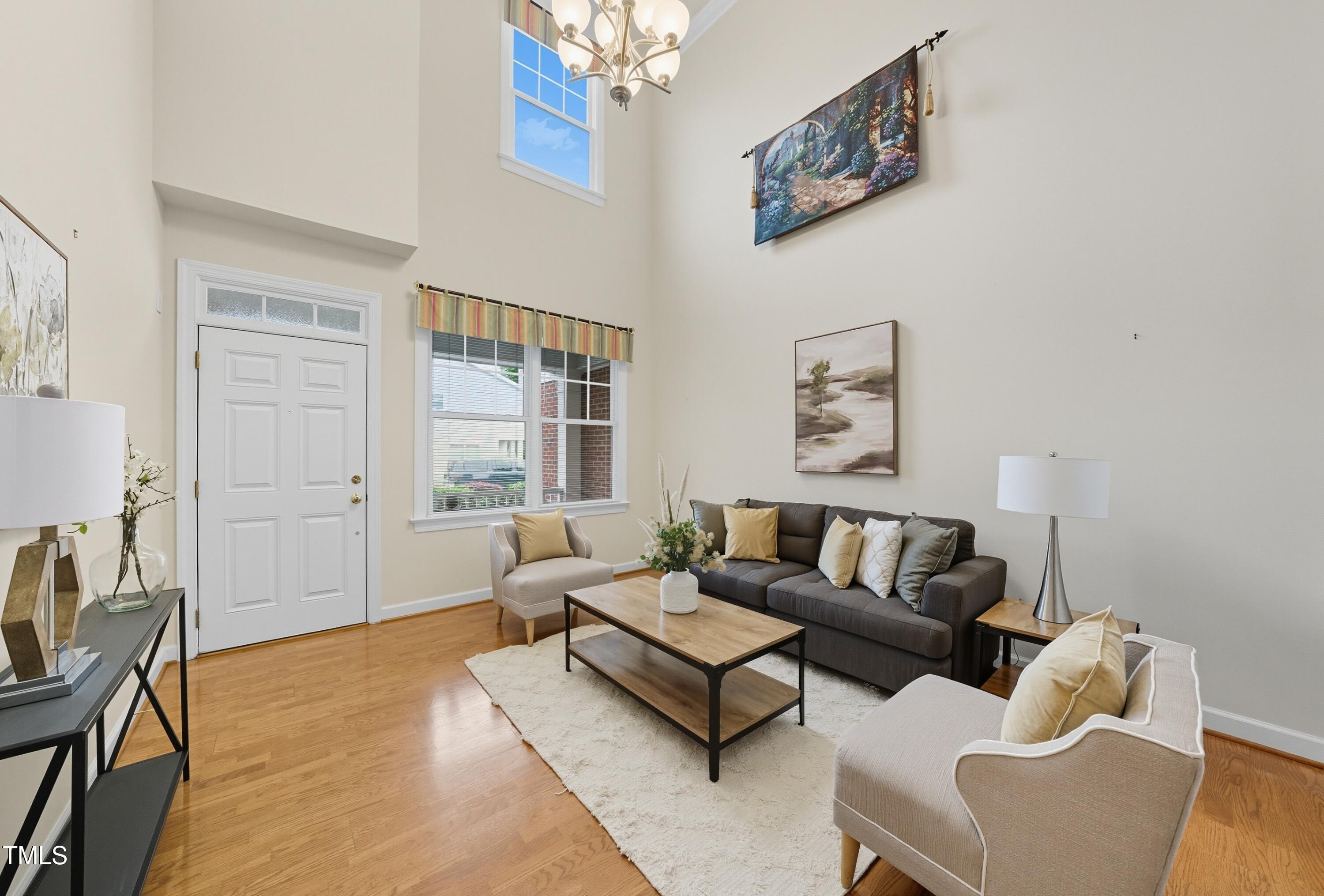 5210 Rio Grande Drive Raleigh, NC 27616 - Photo 6 of 45 a living room with furniture and a large window