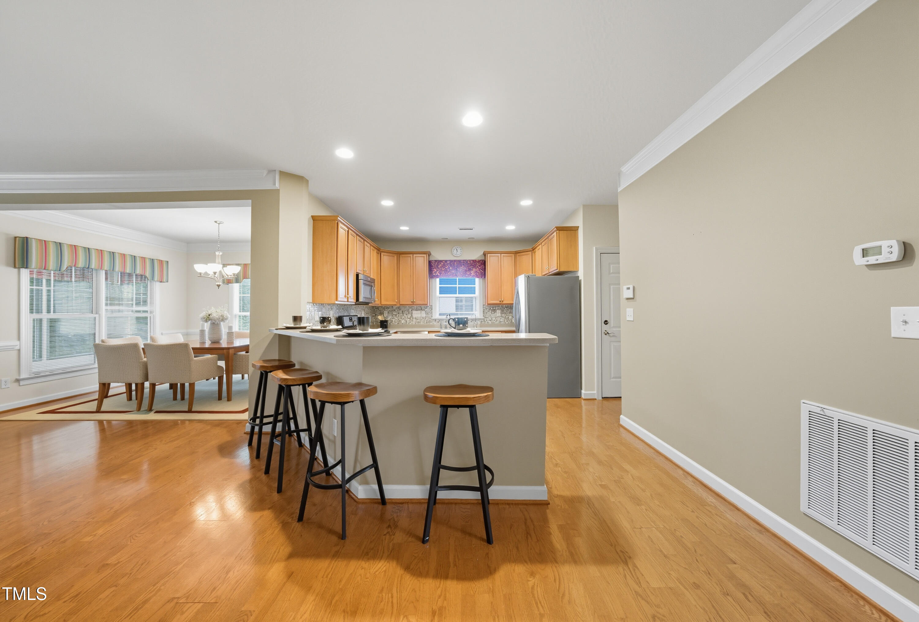 5210 Rio Grande Drive Raleigh, NC 27616 - Photo 9 of 45 a dining room with furniture and wooden floor