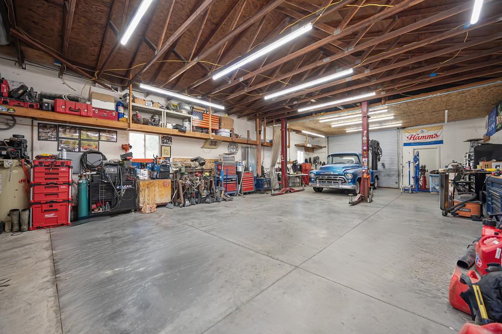3875 Oak Tree Lane Loomis, CA 95650 - Photo 38 of 47 Free standing wood framed 24x48 shop with roll up doors on each end.