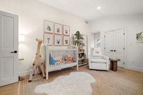 a bedroom with furniture and window