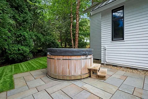 a view of a backyard with sitting area