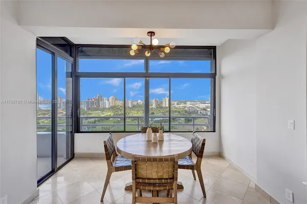 a kitchen with a sink cabinets and wooden floor