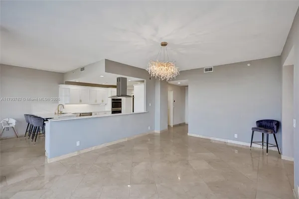 a room with furniture and a book shelf