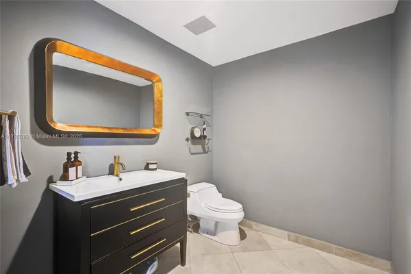 a bed room with a bed and a chair