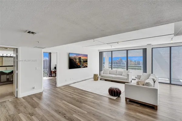 a view of a staircase with white walls