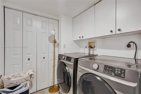 a bedroom with a bed furniture and a flat screen tv