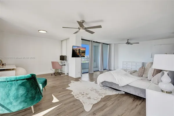 a living room with furniture and a mirror